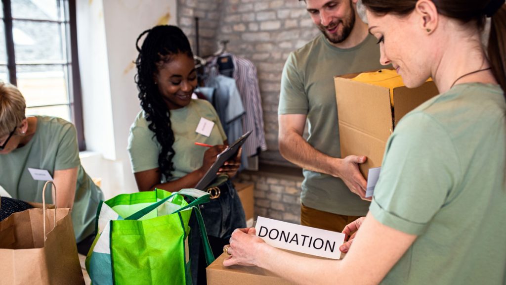 A group of volunteers preparing donations for distribution