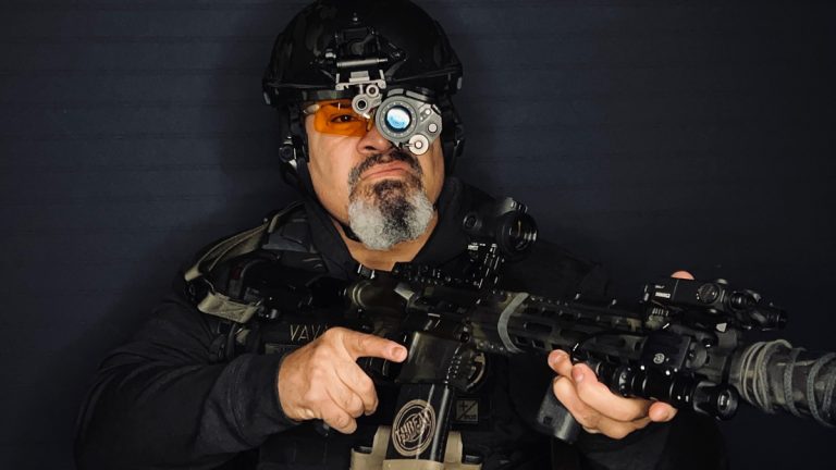 Founder of Threat Reflex, Chief Instructor at Gun for Hire, Vlad Vaval wearing a helmet-mounted night vision monocular.