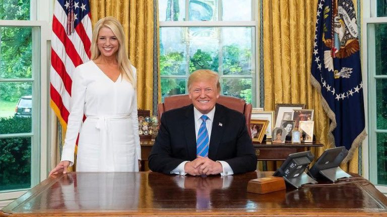 U.S. Attorney General Pam Bondi next to 45th and 47th U.S. President Donald J. Trump.